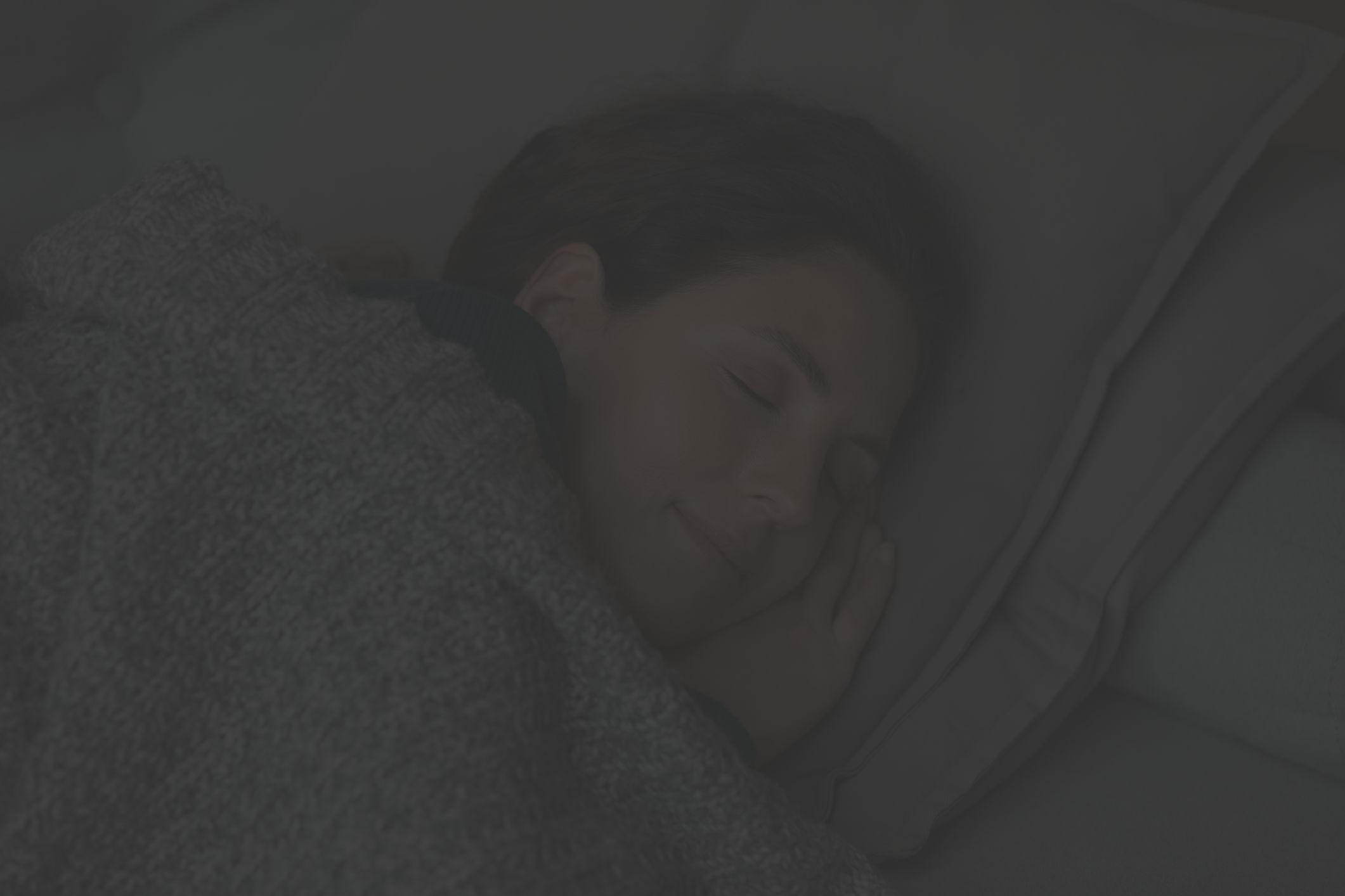 man snoring, headache, woman plugging ears in bed