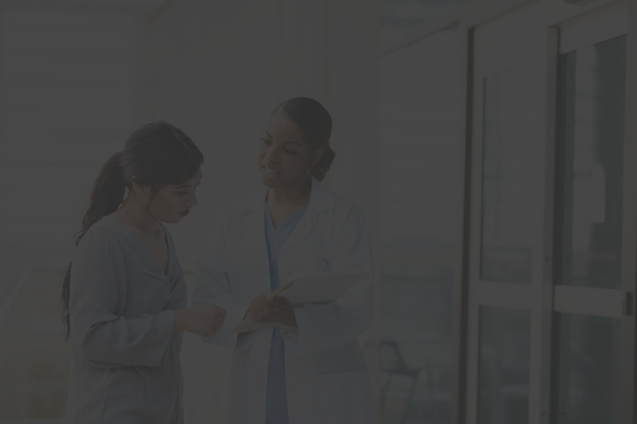 woman talking to obgyn