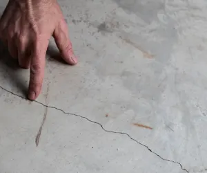 Tiling over concrete? DO THIS to prevent disaster!